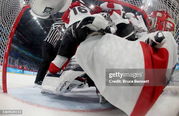 Reto Berra, goaltender of Team Switzerland slide into the net in the second period during the Men's Preliminary Round Group B match on Day 5 of the...