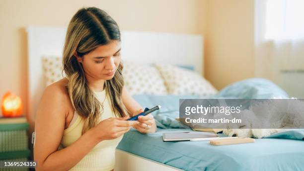 day in the life of young woman with type 1 diabetes - injecting pen stock pictures, royalty-free photos & images