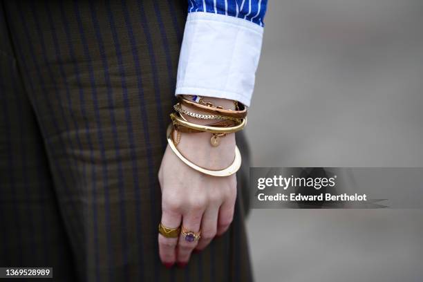 Alba Garavito Torre wears a navy blue and white striped print pattern shirt from Celine, dark green and navy blue striped print pattern wide legs...