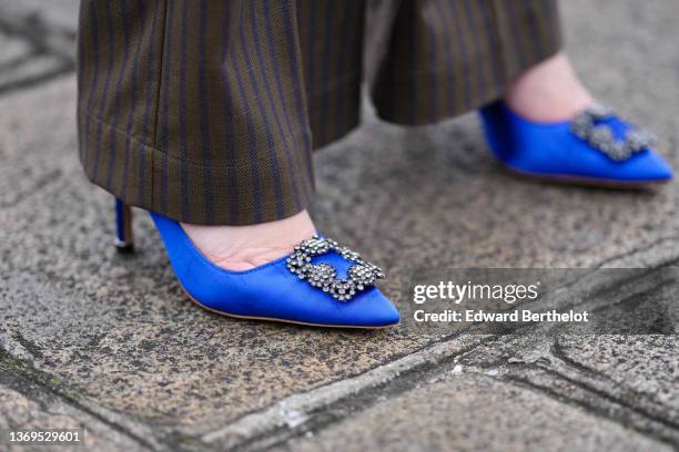 Alba Garavito Torre wears dark green and navy blue striped print pattern wide legs pants from Nina Blanc, royal blue electric shiny silk satin pumps...