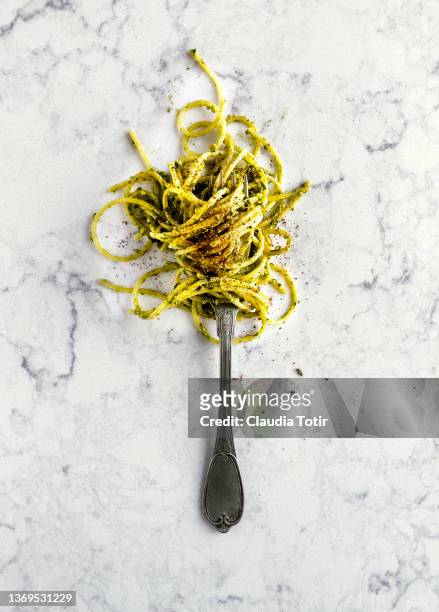 spaghetti on a fork on white, marble background - italien food stock pictures, royalty-free photos & images
