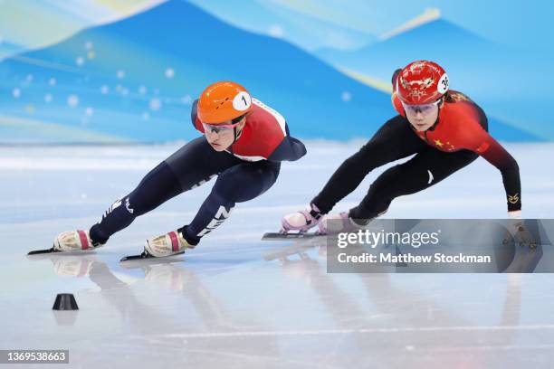 Suzanne Schulting of Team Netherlands and Yutong Han of Team China compete during the Women's 1000m Heats on day five of the Beijing 2022 Winter...