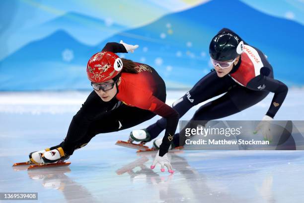 Chunyu Qu of Team China and Xandra Velzeboer of Team Netherlands compete during the Women's 1000m Heats on day five of the Beijing 2022 Winter...