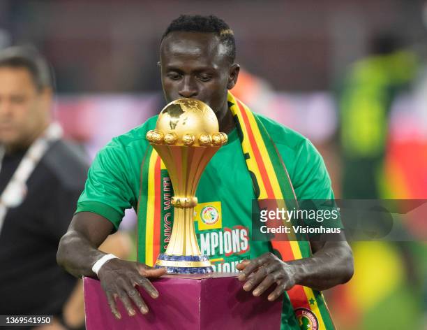 Sadio Mane of Senegal kisses the AFCON trophy after winning the Africa Cup of Nations 2021 final match between Senegal and Egypt at Stade d'Olembe in...