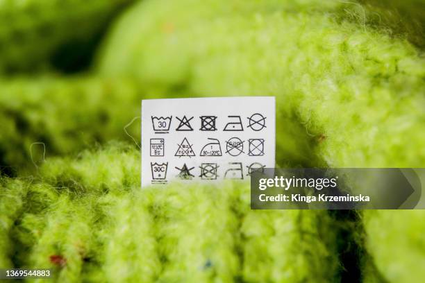 laundry symbols - green jumper stock pictures, royalty-free photos & images