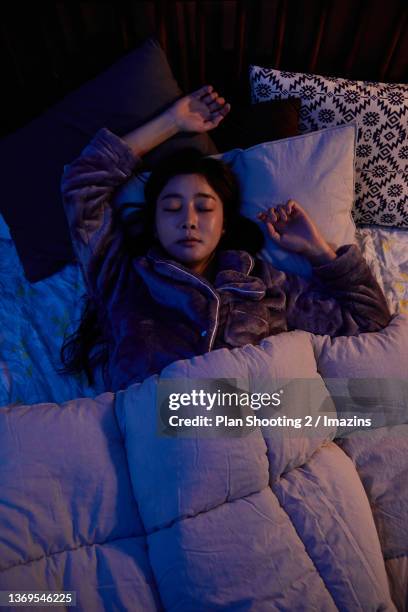 a woman getting stressed by noise between apartment - korea apartment woman stock pictures, royalty-free photos & images