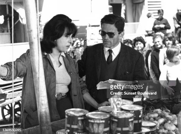 Director Pier Paolo Pasolini directs Italian actress Anna Magnani on the set of the film “Mamma Roma”.