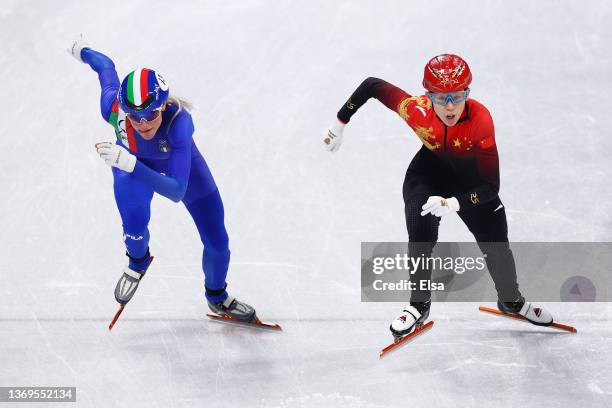 Team Italy and Team China compete during the Women's 3000m Relay Semifinals on day five of the Beijing 2022 Winter Olympic Games at Capital Indoor...