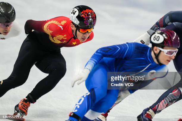 Ren Ziwei of Team China and Daniil Eibog of Team ROC compete during the Men's Short Track Speed Skating 1500m Quarterfinals on Day five of the...