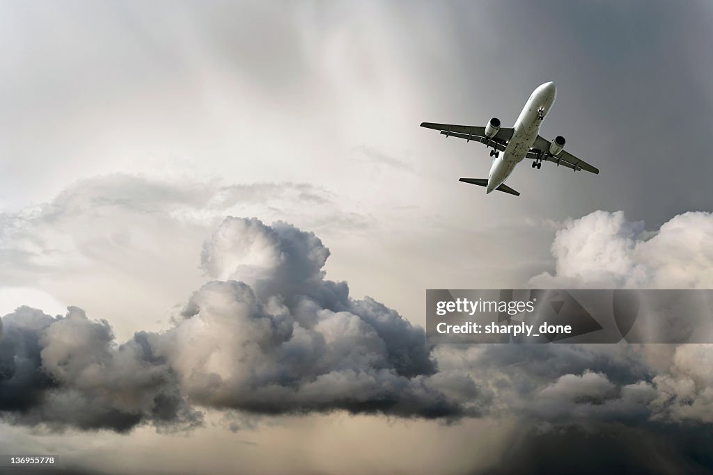 Jet airplane landing in storm