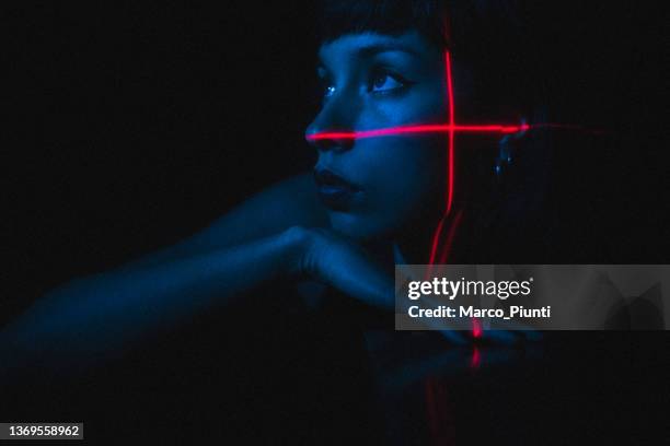 portrait of young woman illuminated neon light and laser - beauty laser bildbanksfoton och bilder