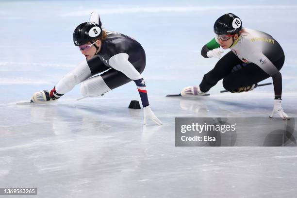 Kristen Santos of Team United States and Petra Jaszapati of Team Hungary compete during the Women's 1000m Heats on day five of the Beijing 2022...