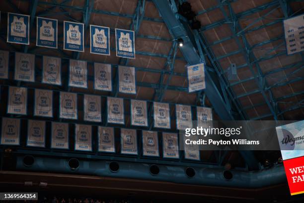 Banner to honor former North Carolina Tar Heels head coach Roy Williams hung with retired jerseys is presented during a game against the North...