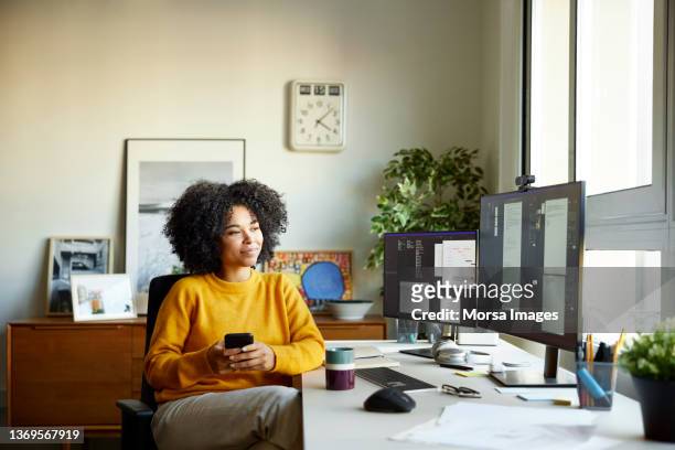 young businesswoman working at home office - black business woman bildbanksfoton och bilder