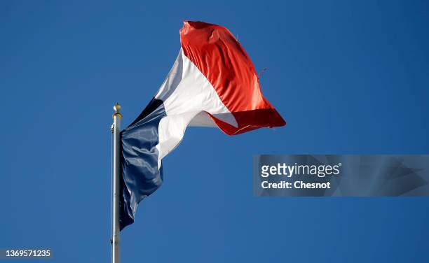 French flag flutters in the sky over the Elysee Presidential Palace during the weekly cabinet meeting on February 09, 2022 in Paris, France. On...