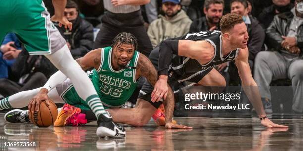 Brooklyn Nets' Blake Griffin losing the ball to Marcus Smart of the Boston Celtics in the first quarter of the game at the Barclays Center in...