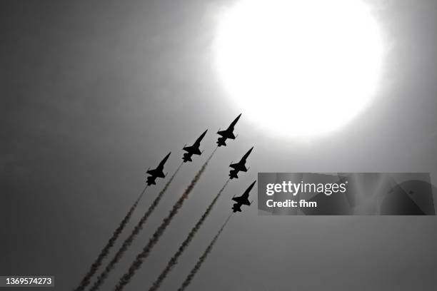 five fighter aircraft reaching the bright sun - war in the air stock pictures, royalty-free photos & images