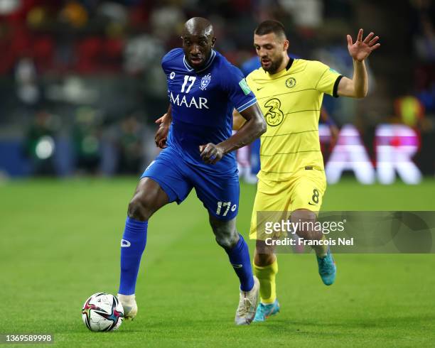 Moussa Marega of Al Hilal runs with the ball from Mateo Kovacic of Chelsea during the FIFA Club World Cup UAE 2021 Semi Final match between Al Hilal...