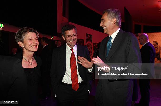 Peter Loescher talks to Herbert Hainer and Angelika Hainer at the Uli Hoeness' 60th birthday celebration at Postpalast on January 13, 2012 in Munich,...
