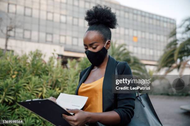 woman in business walking to the office - businesswoman mask stock pictures, royalty-free photos & images