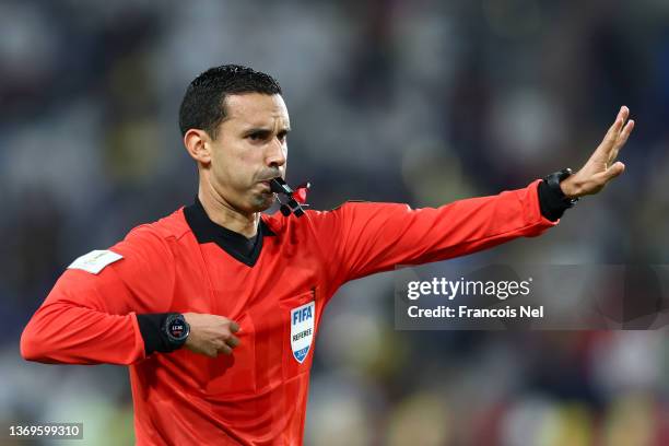 Referee Cesar Ramos blows his whistle during the FIFA Club World Cup UAE 2021 Semi Final match between Al Hilal and Chelsea FC at Mohammed Bin Zayed...