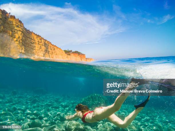 woman diving in algarve - algarve underwater stock pictures, royalty-free photos & images