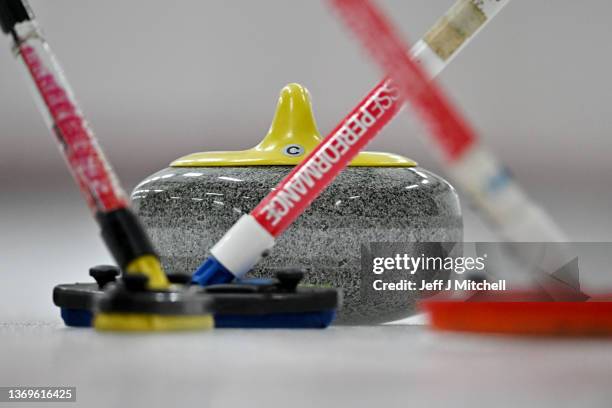 Close-up of a curling stone on the ice as men from Helensburgh Curling Club curl at Greenacres Curling Club on February 9, 2022 in Howood, Scotland....