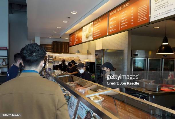 People visit a Chipotle restaurant on February 09, 2022 in Miami, Florida. Chipotle Mexican Grill reported quarterly earnings that topped analyst...