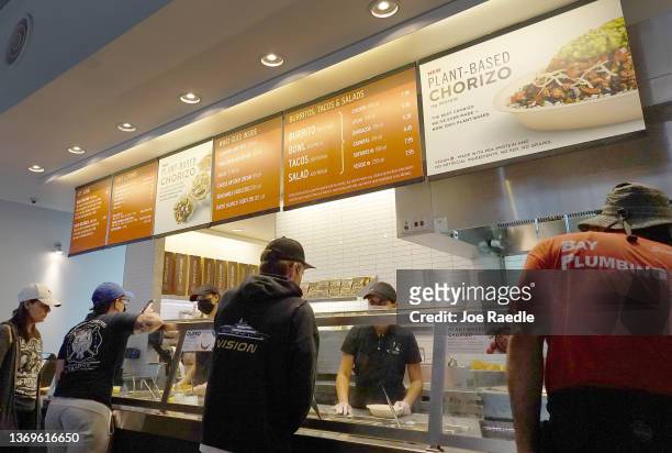 People visit a Chipotle restaurant on February 09, 2022 in Miami, Florida. Chipotle Mexican Grill reported quarterly earnings that topped analyst...
