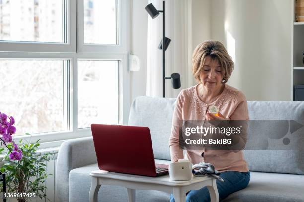 senior woman having an online appointment with doctor from home - telemedicine choicepix stock pictures, royalty-free photos & images