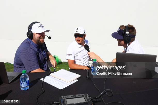 Colt Knost and Drew Stoltz of Subpar with Colt & Drew speak to Rickie Fowler of the United States during the pro-am prior to the WM Phoenix Open at...