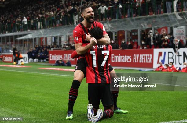 Rafael Leao of AC Milan celebrates with his team-mate Olivier Giroud after scoring the opening goal during the Coppa Italia match between AC Milan ac...