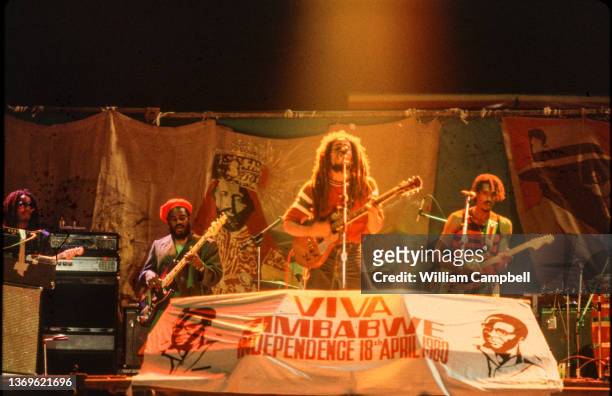 Jamaican Reggae musician Bob Marley plays guitar as he performs onstage, with his band, during the 'Viva Zimbabwe' independence celebration at...