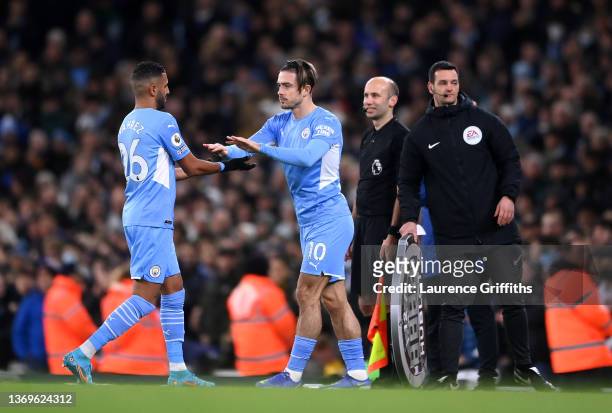 Jack Grealish replaces Riyad Mahrez of Manchester City during the Premier League match between Manchester City and Brentford at Etihad Stadium on...