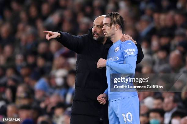 Pep Guardiola gives instructions to Jack Grealish of Manchester City during the Premier League match between Manchester City and Brentford at Etihad...