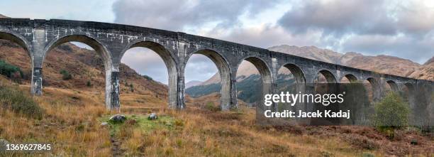 glenfinnan viaduct panorama in the scottish highlands - glenfinnan viaduct scotland stock pictures, royalty-free photos & images