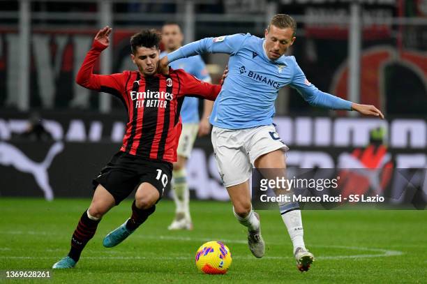 Lucas Leiva of SS Lazio compete for the ball with Brahim Diaz of AC Milan during the Coppa Italia match between AC Milan ac SS Lazio at Stadio...