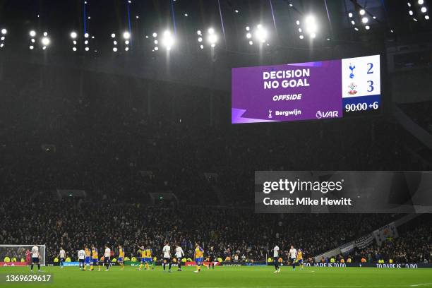 The LED board inside the stadium shows the VAR decision to disallow a goal for Tottenham Hotspur due to an offside for Steven Bergwijn of Tottenham...