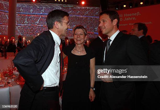 Rene Obermann talks to Herbert Hainer and Angelika Hainer at the Uli Hoeness' 60th birthday celebration at Postpalast on January 13, 2012 in Munich,...