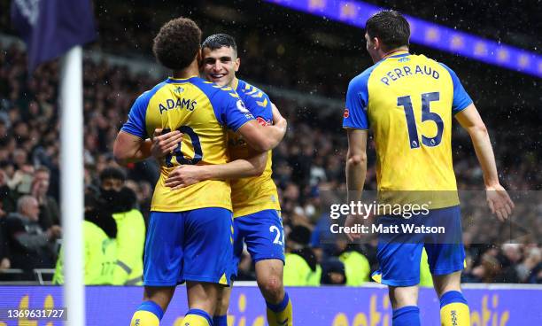 Che Adams of Southampton celebrates with Mohamed Elyounoussi during the Premier League match between Tottenham Hotspur and Southampton at Tottenham...