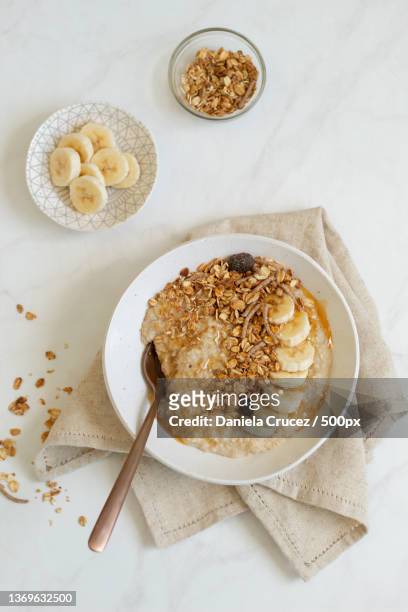 oatmeal and granola,high angle view of dessert in plate on table,panama - atun stock-fotos und bilder