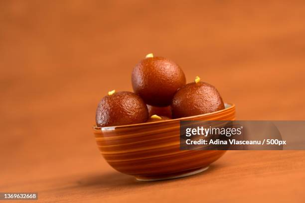 gulab jamun in bowl on wooden background - gulab jamun stock pictures, royalty-free photos & images