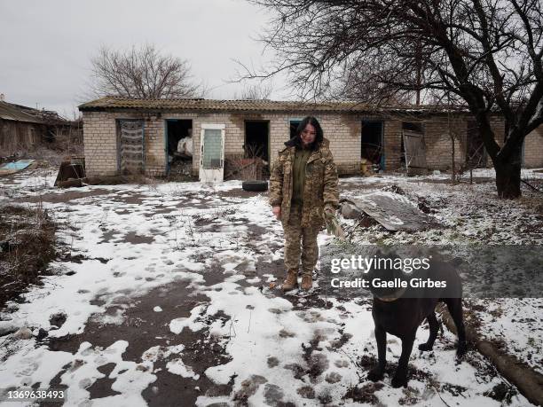 Tania takes out Butch, her Cane Corso, who accompanies her in the conflict as at home on February 9, 2022 in Pisky, Ukraine. Tensions between the...