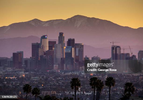 The downtown highrises are viewed at sunrise from the Kenneth Hahn State Recreation Area in the Baldwin Hills Mountains on February 7, 2022 in Los...