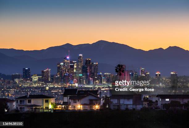 The downtown highrises are viewed at sunrise from the Kenneth Hahn State Recreation Area in the Baldwin Hills Mountains on February 7, 2022 in Los...