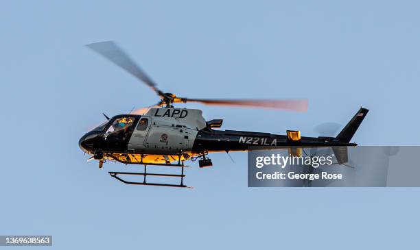 An LAPD helicopter is viewed from an Elysian Park hilltop near downtown on February 7, 2022 in Los Angeles, California. In addition to multiple top...