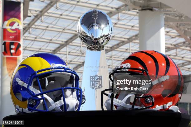 Helmets of the Los Angeles Rams and Cincinnati Bengals sit in front of the Lombardi Trophy as NFL Commissioner Roger Goodell addresses the media on...