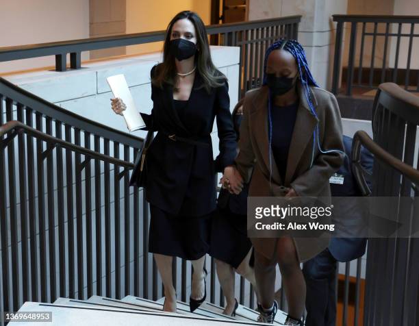 Actress Angelina Jolie leaves with her daughter Zahara Jolie-Pitt after a news conference at the U.S. Capitol February 9, 2022 in Washington, DC....