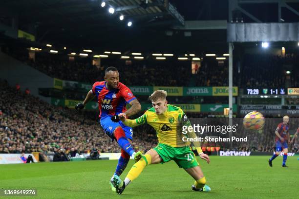 Jordan Ayew of Crystal Palace shoots past Brandon Williams of Norwich City during the Premier League match between Norwich City and Crystal Palace at...