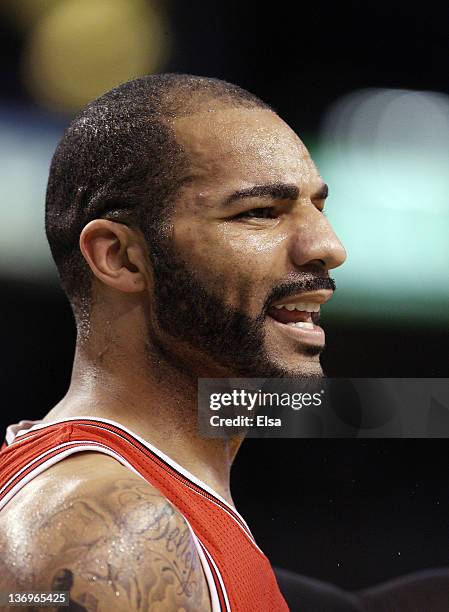 Carlos Boozer of the Chicago Bulls reacts after a foul is called against one of his teammates in the first quarter against the Boston Celtics on...